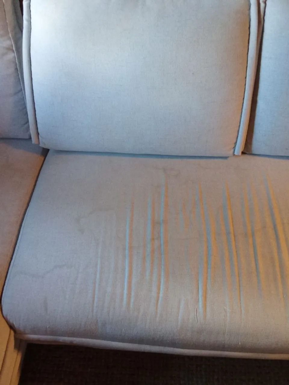 Banquette canapé d'angle avec taches visibles avant nettoyage — Andernos, novembre 2025